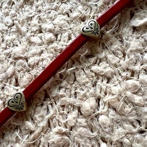 Brighton red belt with hearts and chain.